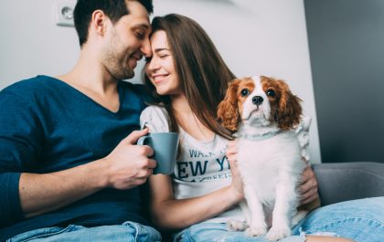 A happy couple with their dog